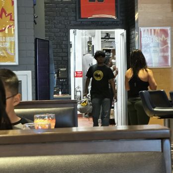 Buffalo Wild Wings - The lights are on but no one's home. There's my fiance at the bar grabbing her items bc no one else was. Check out that stare down. - Chicken Wings Near Me - Fremont, California