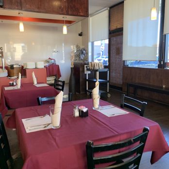 Sree Devaraya’s - empty dining room with pink tablecloths - Indian Near Me - Chandler, Arizona