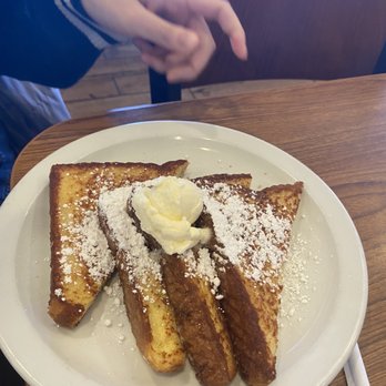 Denny's - a plate of french toast with butter and powdered sugar - Diners Near Me - Patterson, California