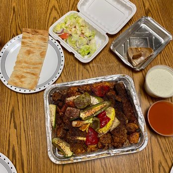 Pukhtun Afghan Cuisine - Pukhtun Chicken & Lamb Platter for Four - Afghan Near Me - New Brunswick, New Jersey Pukhtun Afghan Cuisine - Pukhtun Chicken & Lamb Platter for Four - Afghan Near Me - New Brunswick, New Jersey