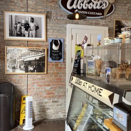 a brick wall and a display case a brick wall and a display case