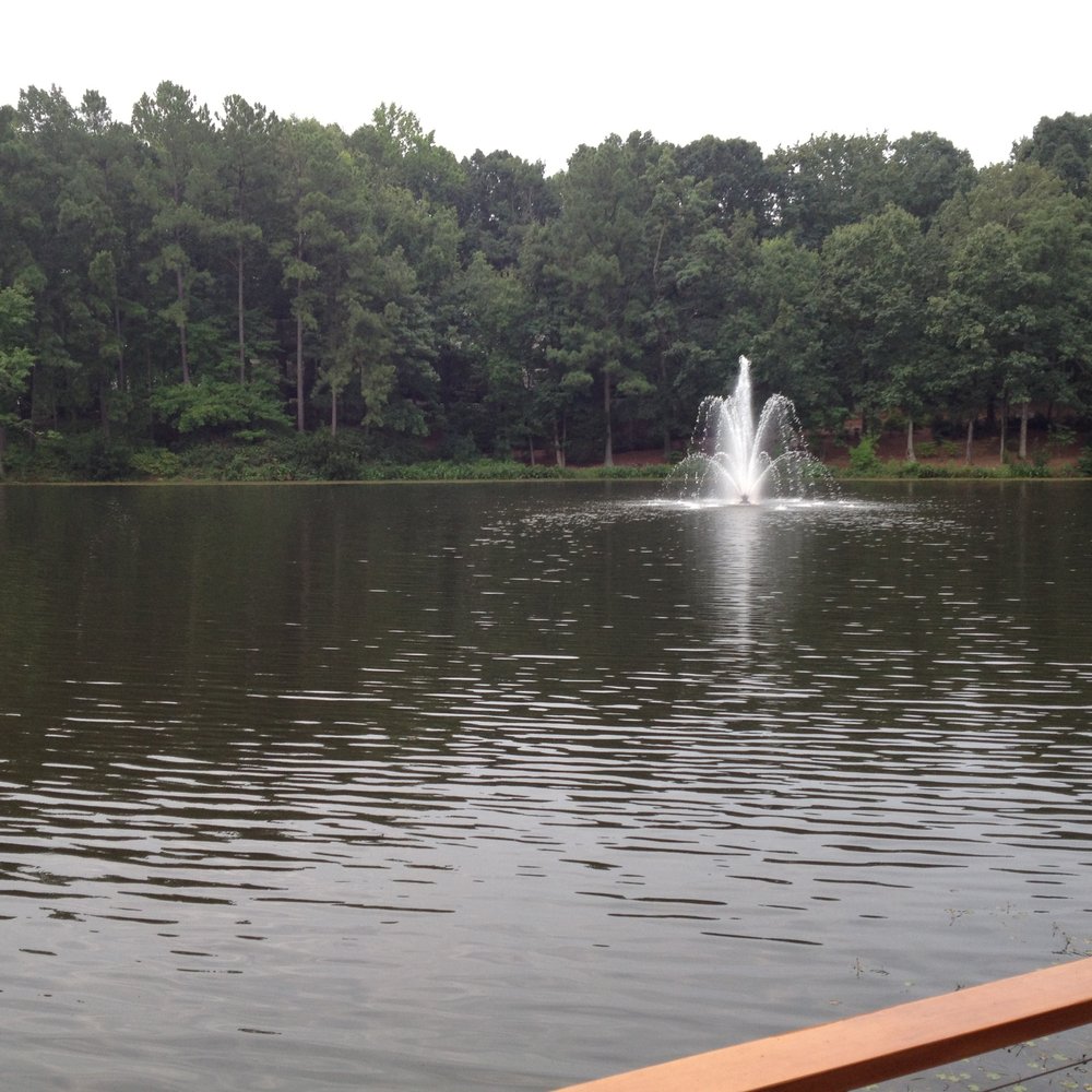 The Umstead Hotel - Part of the lake area, with one of the two fountains. There is a 1/3 mile path around the lake. - Hotels Near Me - Cary, North Carolina The Umstead Hotel - Part of the lake area, with one of the two fountains. There is a 1/3 mile path around the lake. - Hotels Near Me - Cary, North Carolina