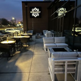 Runaway Whiskey & Wine - the outside seating area - Whiskey Bars Near Me - Charlotte, North Carolina Runaway Whiskey & Wine - the outside seating area - Whiskey Bars Near Me - Charlotte, North Carolina