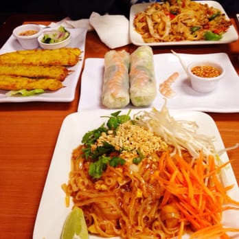 Houa Khong 2 - Chicken satay (left), spring rolls (middle), phat thai (foreground), phat kimow (background). - Thai Near Me - Merced, California Houa Khong 2 - Chicken satay (left), spring rolls (middle), phat thai (foreground), phat kimow (background). - Thai Near Me - Merced, California