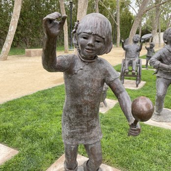Cerritos Sculpture Garden - Child holding maracas - Public Art Near Me - Cerritos, California