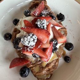 Croissant with cream and berries