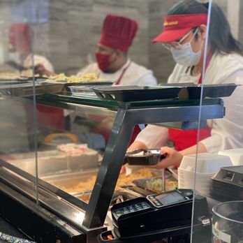 Sarku Japan - a group of people preparing food - Japanese Near Me - Aurora, Colorado