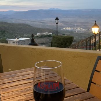 Jerome Grand Hotel - Glass of wine at the Asylum restaurant. Nice Pinot Noir - Hotels Near Me - Jerome, Arizona