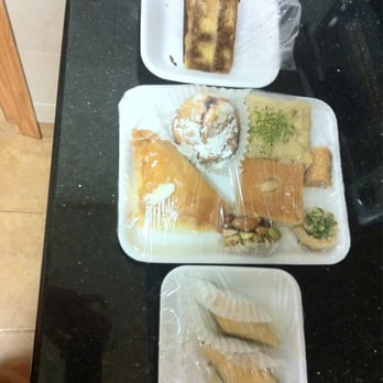 Al-Sham Sweets  - tiramisu on the top, cream filled baklava on middle left - Desserts Near Me - Astoria, New York