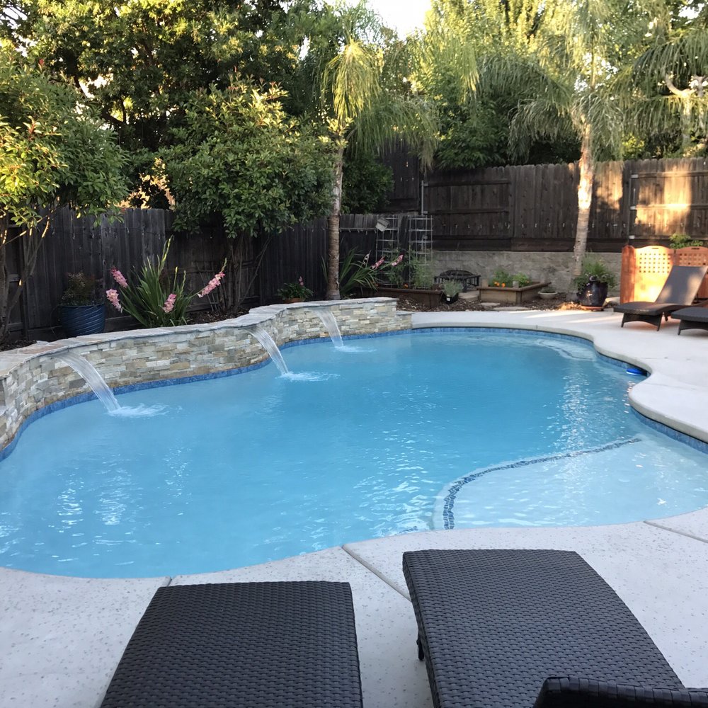 Generation Pool Plastering - After! Gorgeous sheer descent waterfalls controlled on a phone app! On a strong cement/stone wall that Val says "will hold 1000 people" - Pool & Hot Tub Service Near Me - West Sacramento, California Generation Pool Plastering - After! Gorgeous sheer descent waterfalls controlled on a phone app! On a strong cement/stone wall that Val says "will hold 1000 people" - Pool & Hot Tub Service Near Me - West Sacramento, California