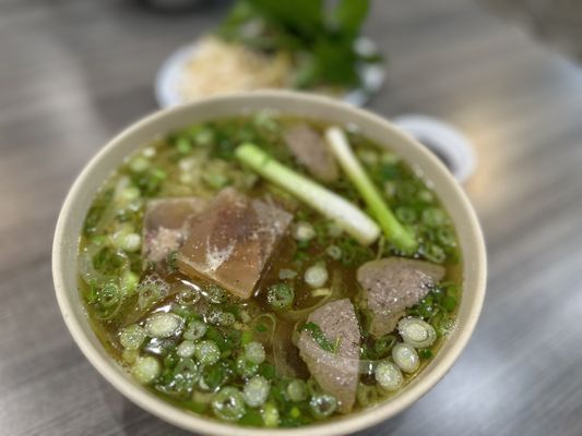 Photo of Pho Phong Luu - Austin, TX, US. a bowl of soup with meat and vegetables