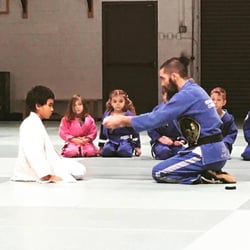 P5 Academy - Presenting a belt promotion in Brazilian Jiu Jitsu to a member of the kids / youth program at P5 Academy in San Diego, Ca.