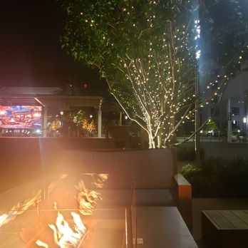 Bosscat Kitchen & Libations - sitting outside after eating, outside of restaurant on couches with fire - New American Near Me - Irvine, California Bosscat Kitchen & Libations - sitting outside after eating, outside of restaurant on couches with fire - New American Near Me - Irvine, California