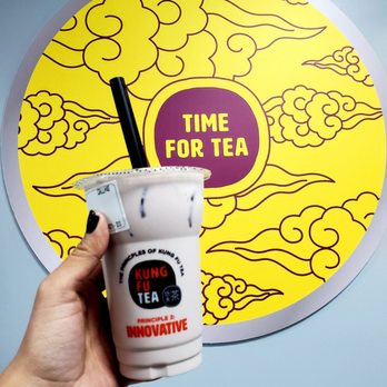 Kung Fu Tea - a hand holding a cup of tea - Coffee & Tea Near Me - Plainfield, Indiana