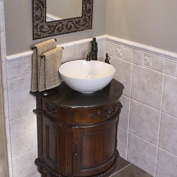 Re-Bath - a sink and mirror in a bathroom - General Contractors Near Me - Springfield, Missouri