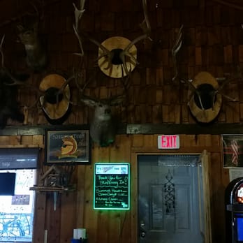 The Frontier Bar - deer heads mounted on the wall - American Near Me - Rexford, Montana