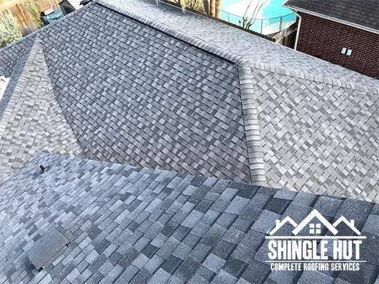 Slide of Shingle Hut Complete Roofing Services