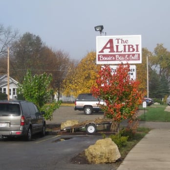 The Alibi - cars parked in a parking lot - Sports Bars Near Me - Beloit, Wisconsin The Alibi - cars parked in a parking lot - Sports Bars Near Me - Beloit, Wisconsin