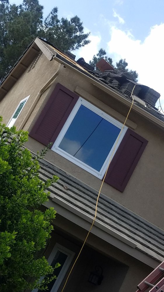 Slide of New Era Roofing