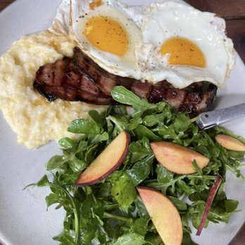 Manuela - Thick Cut Bacon, Pencil Cob Grits, Fried Egg, Sage Maple - New American Near Me - Los Angeles, California Manuela - Thick Cut Bacon, Pencil Cob Grits, Fried Egg, Sage Maple - New American Near Me - Los Angeles, California