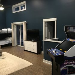 Luxe Haus Cabin Rental - 3rd King size bedroom and vintage arcade games including Golden Tee.
