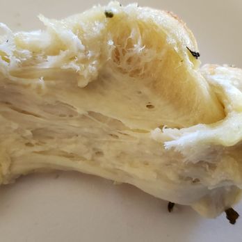 Oggi's - Inside my garlic knot...raw, stretchy dough - Pizza Near Me - Encinitas, California Oggi's - Inside my garlic knot...raw, stretchy dough - Pizza Near Me - Encinitas, California