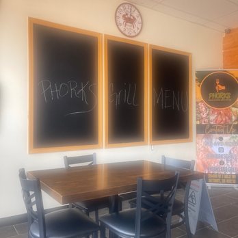 Phork Grill - a table and chairs in a restaurant - Seafood Near Me - Detroit, Michigan