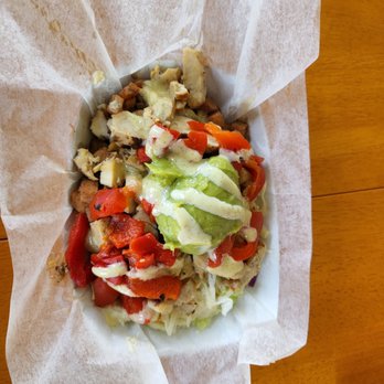 Effortlessly Healthy - a bowl of food on a wooden table - Food Trucks Near Me - rochester, New York