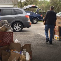 Hope Ministries Food Pantry - Food is distributed according to family size and volunteers load it into recipients' cars.