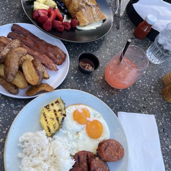 Deck. - Deep Dish Haupia French Toast (top), side of bacon and potatoes, Diamond Head Breakfast (bottom) - Hawaiian Near Me - Honolulu, Hawaii