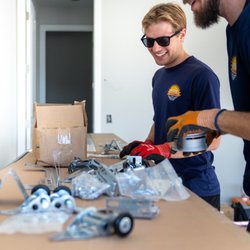 Paradise Garage Doors - Paradise Garage Doors technicians preparing quality parts for professional garage door installation and repair throughout Brevard County.