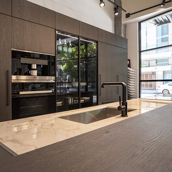 Pedini NW - Pedini oak veneer tall cabinet units, countertop Dekton in Bergen Stonika, Miele appliances - Kitchen & Bath Near Me - Portland, Oregon Pedini NW - Pedini oak veneer tall cabinet units, countertop Dekton in Bergen Stonika, Miele appliances - Kitchen & Bath Near Me - Portland, Oregon