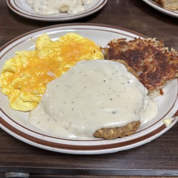 Hole 'n One - Chicken fried steak with hash browns and scrambled eggs with cheese. - American Near Me - Sun City West, Arizona Hole 'n One - Chicken fried steak with hash browns and scrambled eggs with cheese. - American Near Me - Sun City West, Arizona