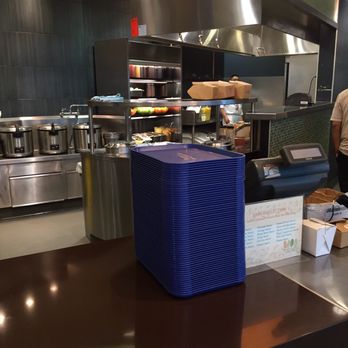 Rice Tales - a man standing in a kitchen preparing food - Fast Food Near Me - Richmond, British Columbia