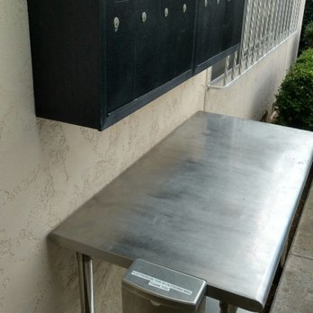 US Post Office - Right there under the mail boxes. He is already there. It's part of his job. - Post Offices Near Me - San Diego, California