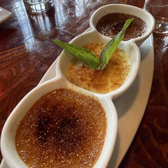 Toulouse Petit Kitchen & Lounge - Crème brûlée trio: vanilla, traditional, chocolate - Seafood Near Me - Seattle, Washington Toulouse Petit Kitchen & Lounge - Crème brûlée trio: vanilla, traditional, chocolate - Seafood Near Me - Seattle, Washington