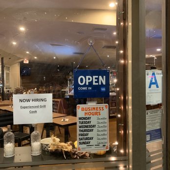 Continental Kitchen - Open sign. Hours showing. Closed restaurant 8:30pm on a Tuesday. - Mediterranean Near Me - Beverly Hills, California