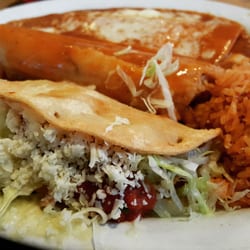 La Tapatia Mexican Restaurant and Cantina - I had the no. 8 combo with a with a chicken taco, a chicken tamale, and a cheese enchilada with rice and beans.