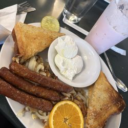 Billy's Family Restaurant - Two eggs any style with sausages and toast.