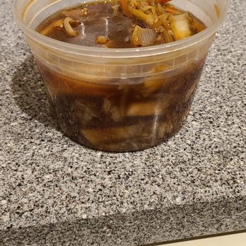 Dragon Wok - a bowl of soup sitting on top of a stove - Chinese Near Me - Horseheads, New York