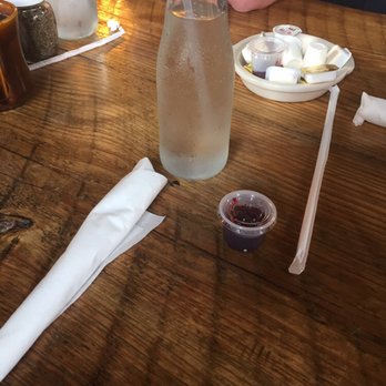 Two Cracked Eggs Cafe - Water and container of jam - Breakfast & Brunch Near Me - Savannah, Georgia