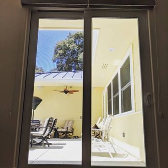 The Blind Lady - Roller Shades on a Sliding Glass Door (Open) - Shades & Blinds Near Me