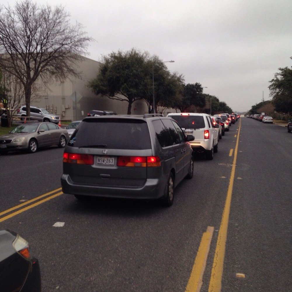 Operation Blue Santa - Cars in line at 8:30am to pick up boxes of presents & food for delivery to signed-up families - Community Service/Non-Profit Near Me - Austin, Texas