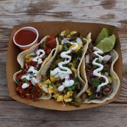 Shreddy’s Tacos - Breakfast tacos (trio): al pastor, nopales, and Carne Asada breakfast tacos topped with egg, onion, cilantro, and our special crema
