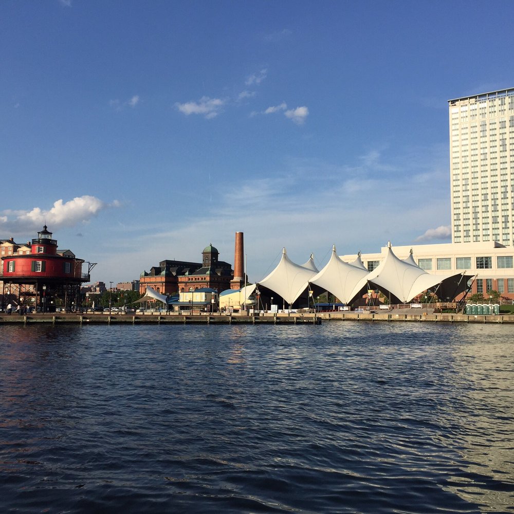 Baltimore Water Taxi - Lighthouse and pavilion from boat - Boat Charters Near Me - Baltimore, Maryland