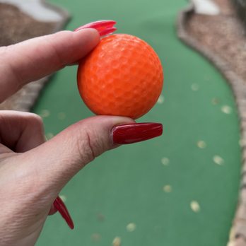 Hawaiian Rumble Adventure Golf - My ball; the greens in the background in great shape. (A few random leaves fell) - Mini Golf Near Me - Orlando, Florida Hawaiian Rumble Adventure Golf - My ball; the greens in the background in great shape. (A few random leaves fell) - Mini Golf Near Me - Orlando, Florida