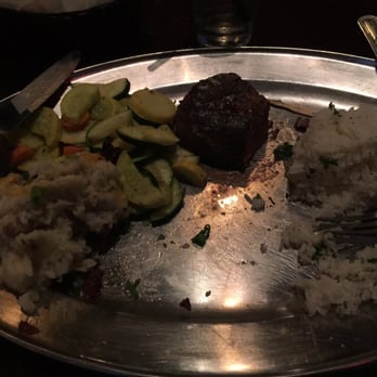 Saddle Ranch - Filet mignon w Cilantro Jasmine rice. The meat was cooked to perfection!! A smaller plate would improve the presentation - Steakhouses Near Me - Orange, California Saddle Ranch - Filet mignon w Cilantro Jasmine rice. The meat was cooked to perfection!! A smaller plate would improve the presentation - Steakhouses Near Me - Orange, California