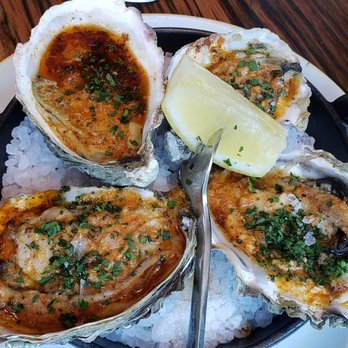FlintCreek Cattle - Oven Roasted Barron Point Oysters, garlic, lemon-anchovy butter, parsley, sea salt - New American Near Me - Seattle, Washington FlintCreek Cattle - Oven Roasted Barron Point Oysters, garlic, lemon-anchovy butter, parsley, sea salt - New American Near Me - Seattle, Washington