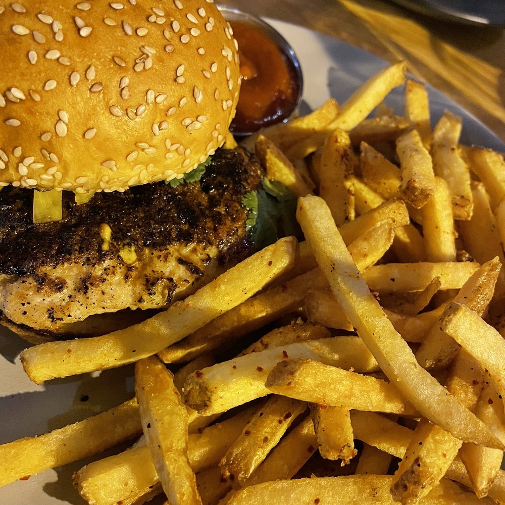 Yellowbelly - Jerk chicken burger with beef fat fries - New American Near Me - St. Louis, Missouri Yellowbelly - Jerk chicken burger with beef fat fries - New American Near Me - St. Louis, Missouri