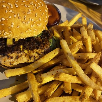Yellowbelly - Jerk chicken burger with beef fat fries - New American Near Me - St. Louis, Missouri Yellowbelly - Jerk chicken burger with beef fat fries - New American Near Me - St. Louis, Missouri